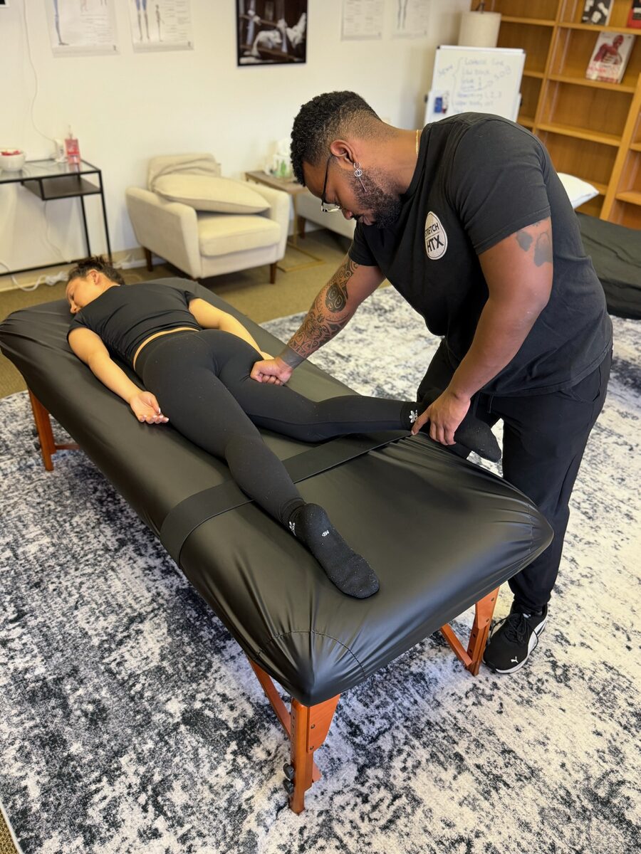 Assisted glute and hip stretch at Stretch Therapy HTX
